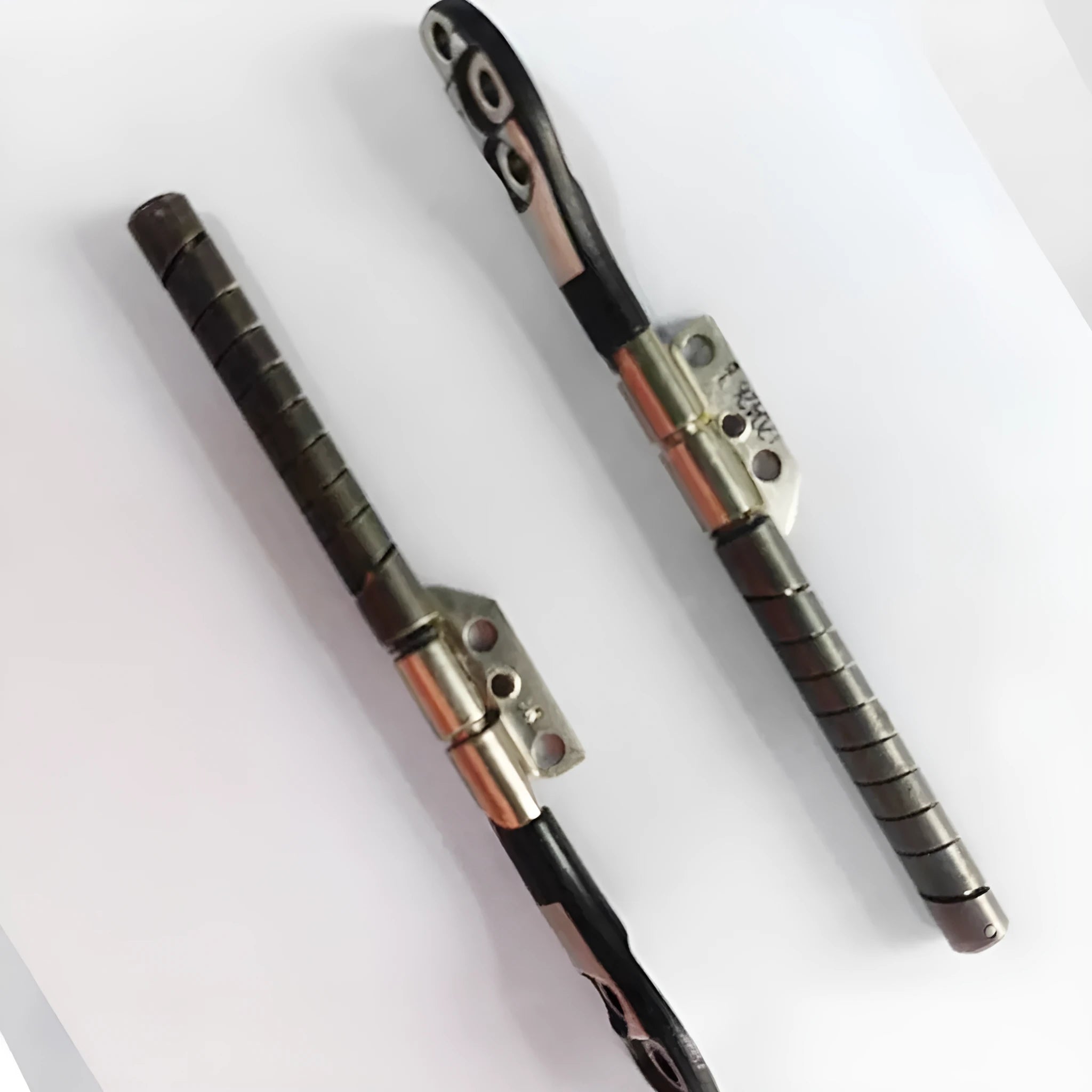 MacBook Pro 15-inch A1286 laptop screen hinge shaft replacement part on foam packaging.
