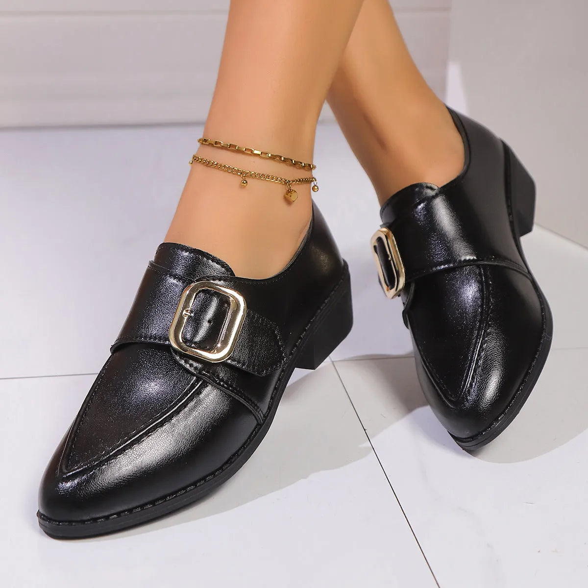 Women's simple leather shoes with a choice of large buckle bow or small bowknot decoration, pointed toe, and rubber sole.