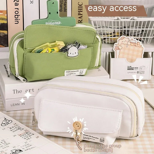 Korean-style canvas pencil case in green, beige, blue or grey holding multiple pens