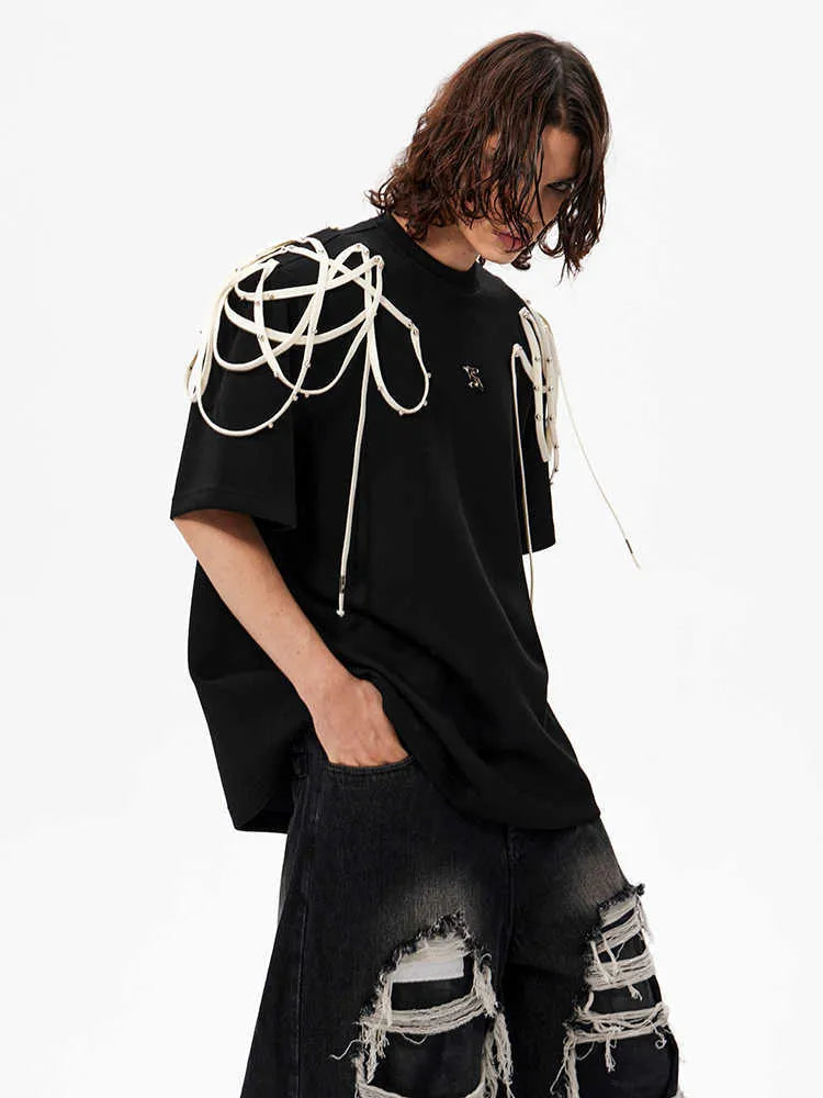 Black loose fit women's T-shirt with padded shoulders featuring rivet ribbon detail