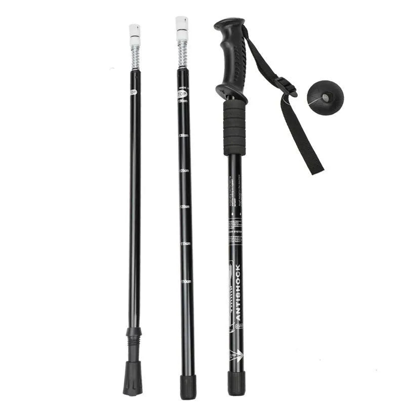 A pair of adjustable aluminium trekking poles with a three straight handle, shown with mud supports, snow holders, and foot covers.