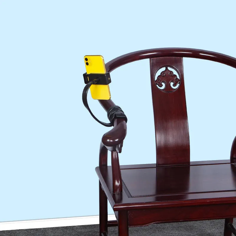 Flexible adjustable silicone and aluminium hose phone holder bent into an S-shape.