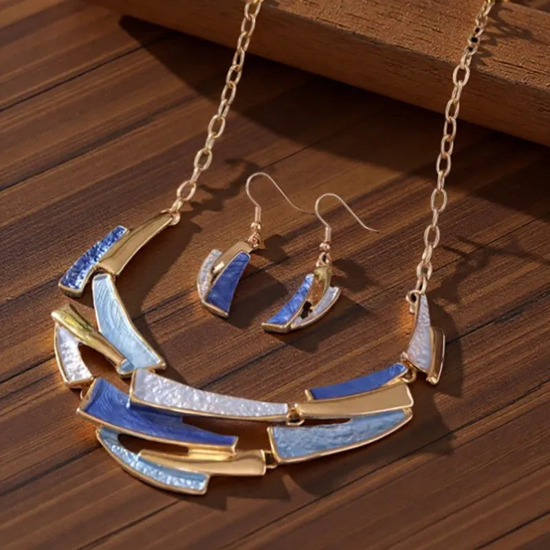 Blue zinc alloy bohemian necklace and earring set with irregular quadrilateral pendants on a light surface
