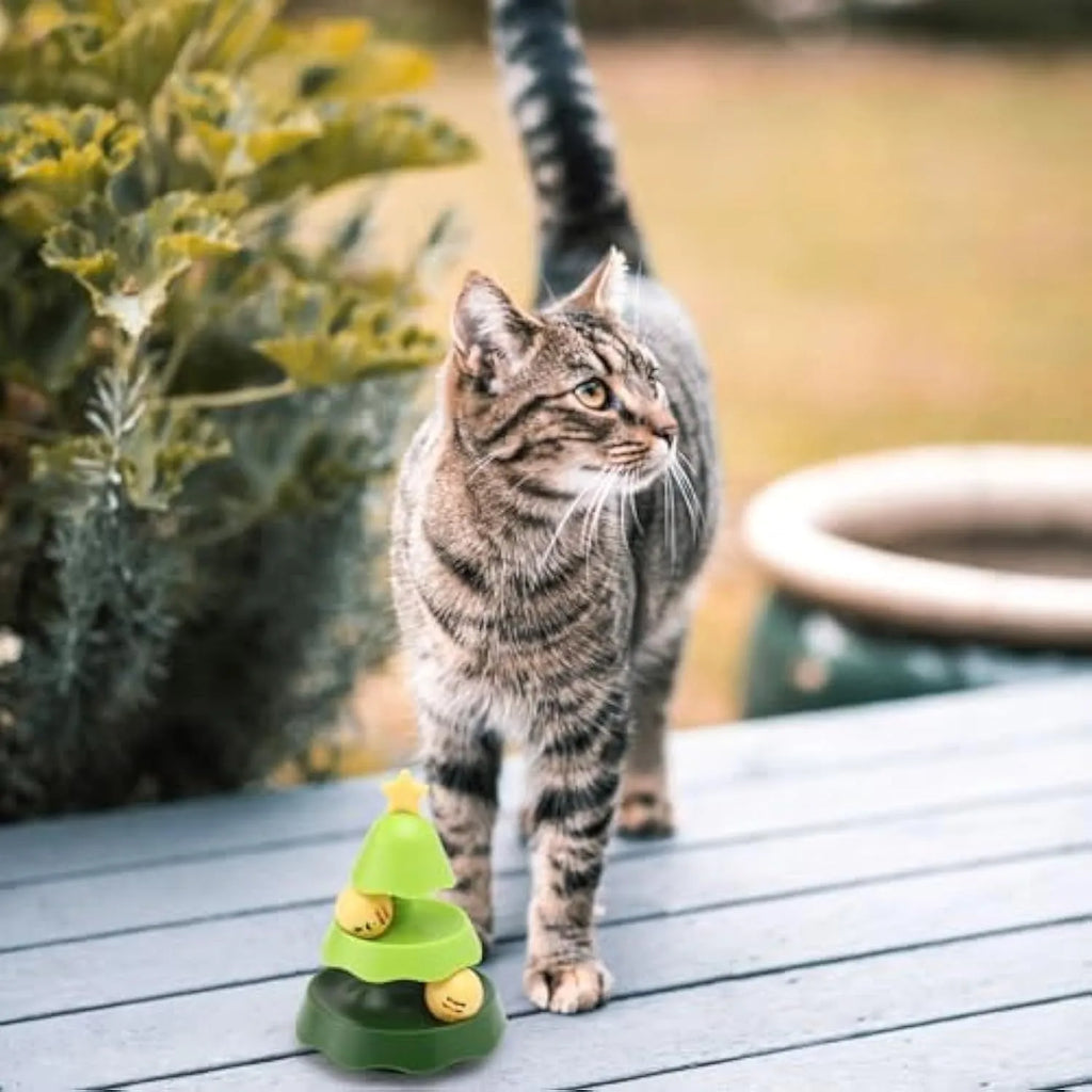 Green tree-shaped cat toy with two-level track, two moving balls, and top catnip ball under cover.