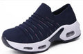 Women's plus size fly-knit socks shoes in stretch mesh with low heel and round toe.