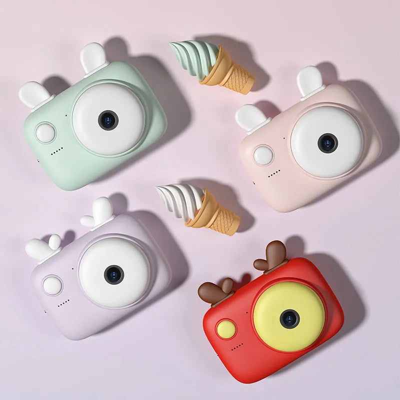 A2 Kids Macaron Mini SLR digital camera in choice of colours, showing compact 90mm x 61mm size with 2.4-inch screen.
