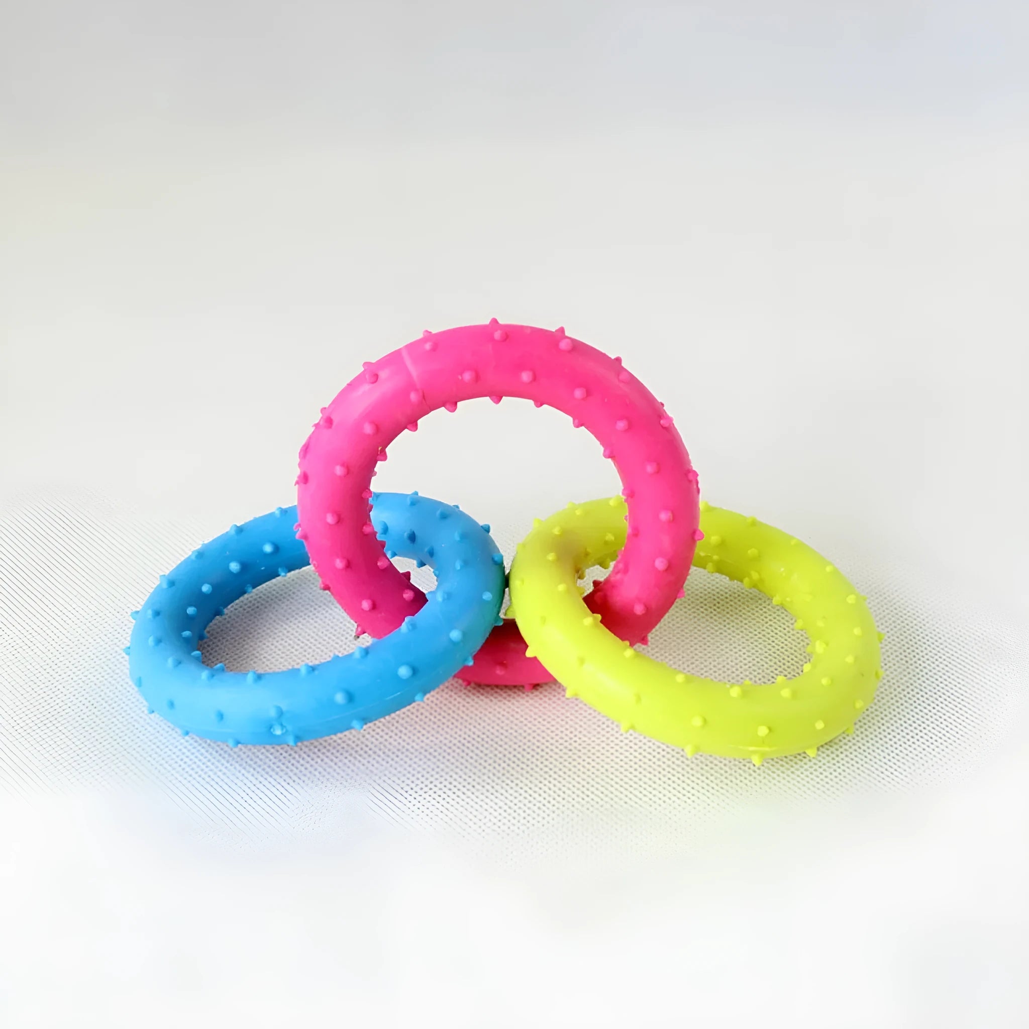 Rubber three-chain dog bite-resistant molar toy made from TPR material for pet dental health