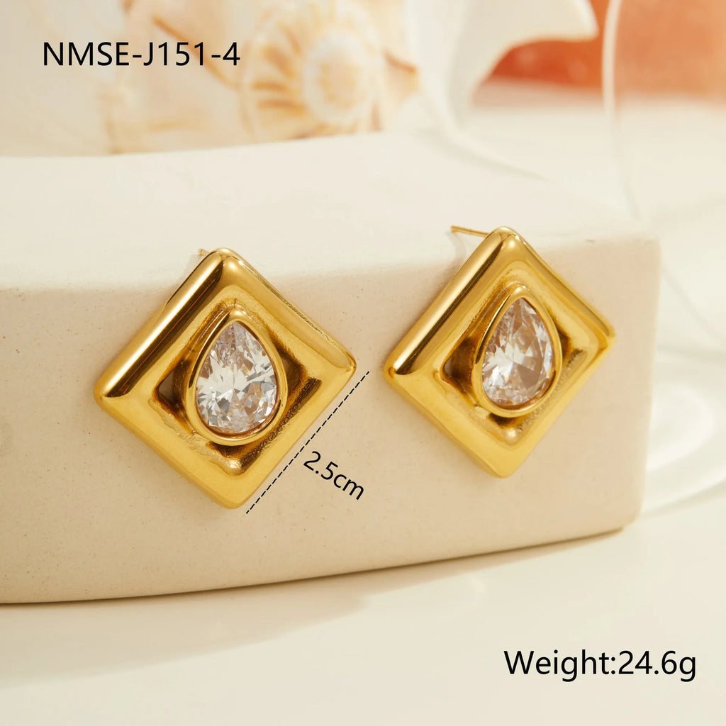 A pair of gold-coloured geometric stud earrings featuring an inlaid water drop zircon stone.