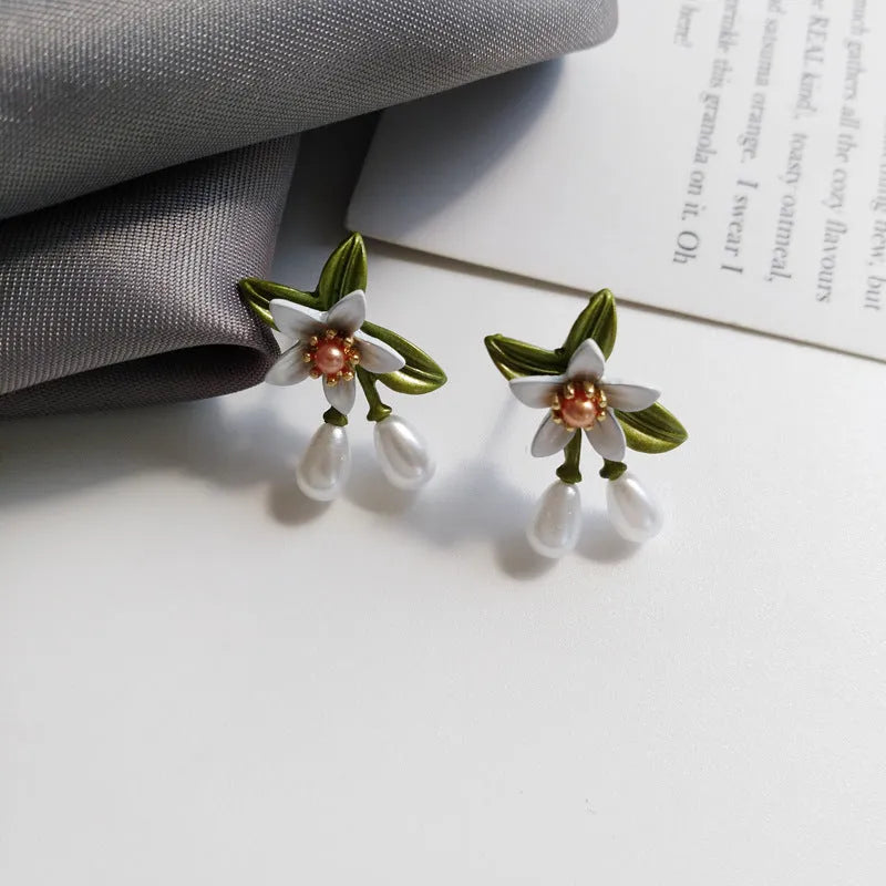 Sterling silver needle camellia earrings with contrast color alloy flower body for women