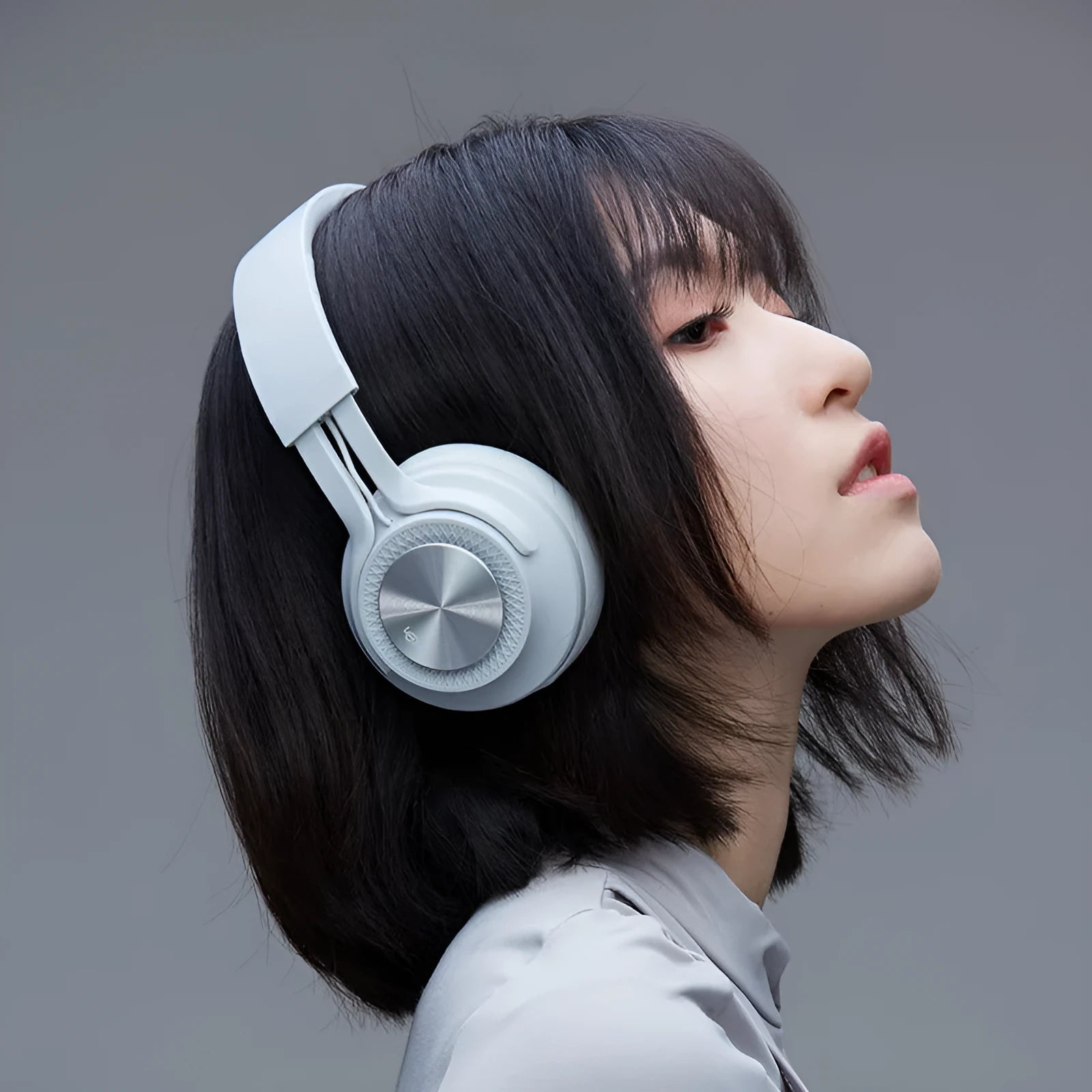 Wireless Bluetooth sports headset in black, green, grey, or red, showing over-ear design.