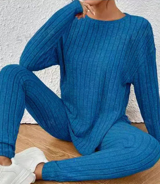 Black sunken stripe two-piece lounge set for women, showing top and pants.