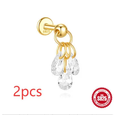 S925 sterling silver geometric moon and star earrings with diamond detail on a gold tone background.