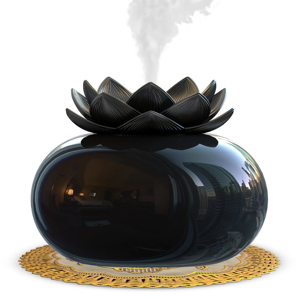 Pure black round Lotus aromatherapy ultrasonic humidifier with USB cable on a desk.
