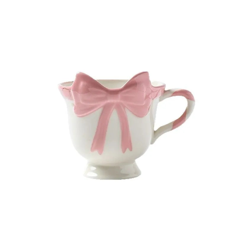 Ceramic mug with a cute girl heart bow design in white powder and black pink colours.