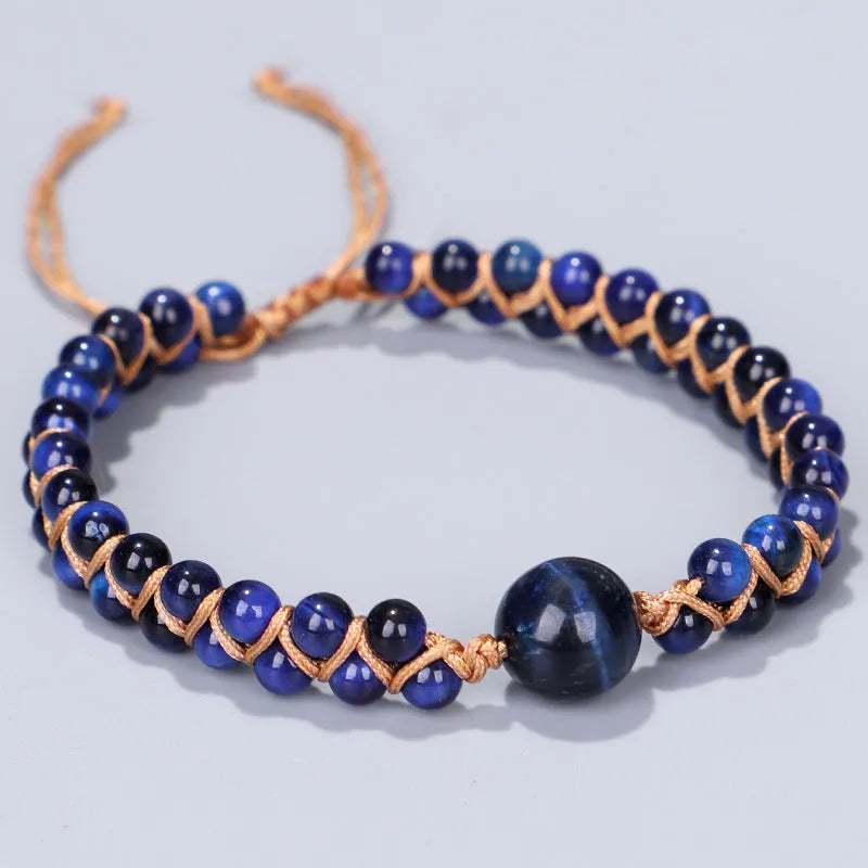 Handmade woven geometric pull bracelet in Tigereye stone showing blue and amethyst colour options