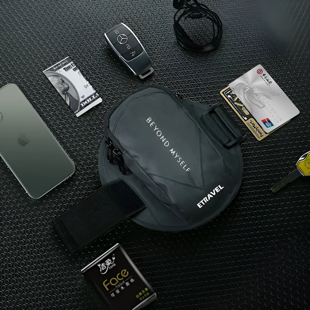 Reflective black running arm bag with adjustable strap, holding a mobile phone, shown on a runner's arm.