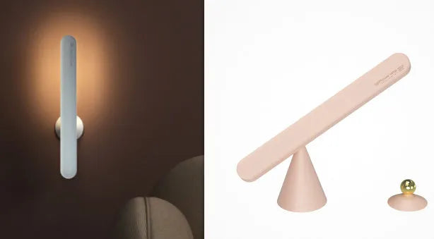 White geometric desk lamp with touch control and magnetic base on a wooden table.