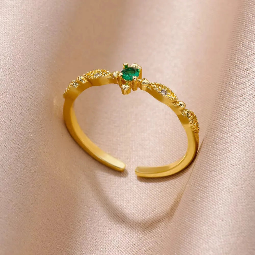18K gold plated copper open mouth ring with synthetic zircon love emerald motif on white background