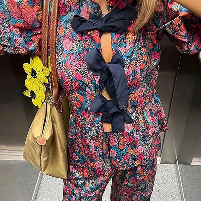 Women's floral print tie-neck long sleeve top with puff sleeves and matching trousers suit set