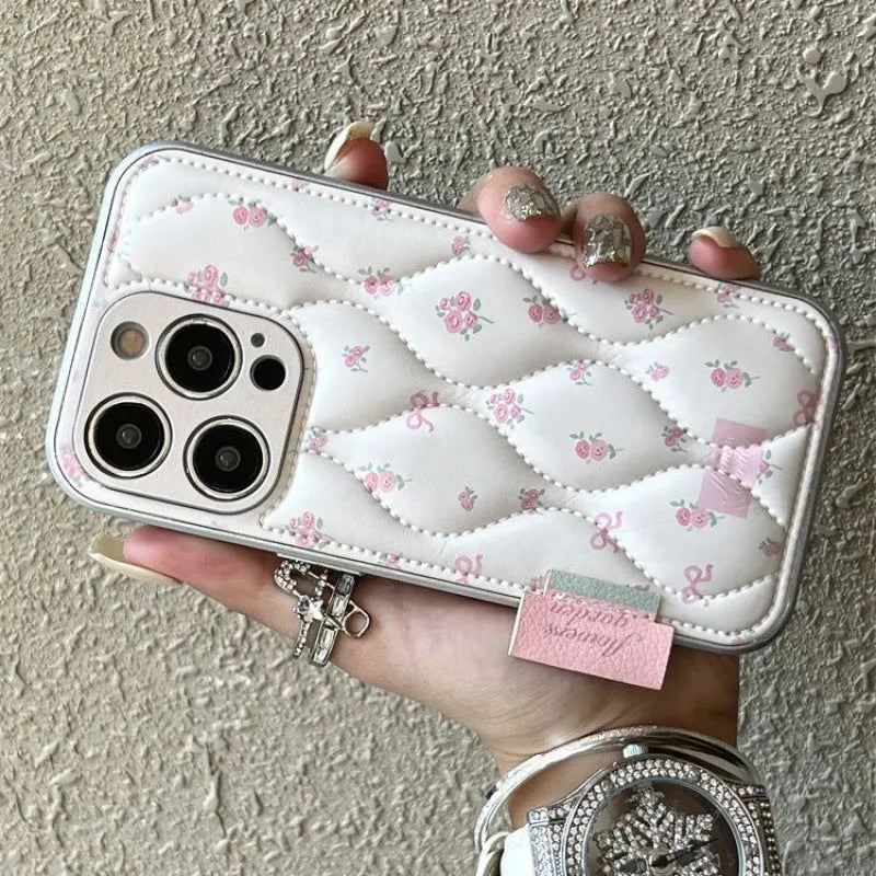 Creative down jacket small floral leather phone case with embossed design for iPhone showing purple background