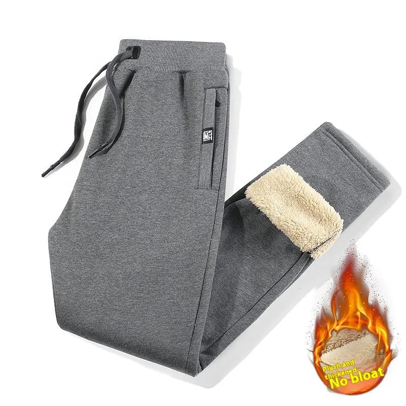 Men's grey fleece-lined cotton track pants with oversized fit and straight leg design