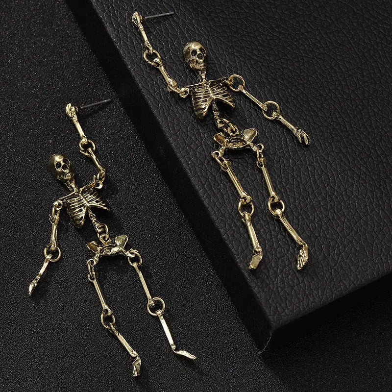 Exaggerated zinc alloy skull earrings in antique silver with line-patterned detailing, unisex design