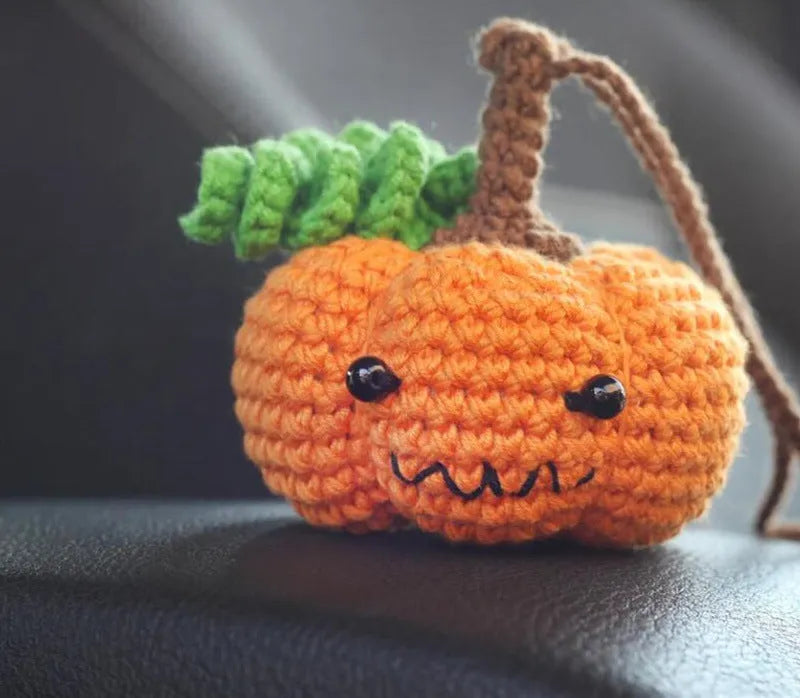 Plush hand-woven car hanging ornament in a cartoon design, made from soft polyester fabric.