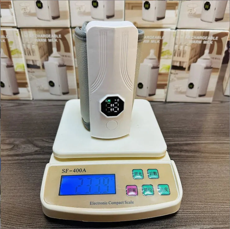 Grey and white car charger electric milk warmer for baby bottles.