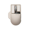 Xiaoqiao Tofu coloured three-mode wireless mouse with ergonomic shape on a desk.