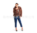 Women's loose brown faux fur hooded coat on a model, street fashion style.
