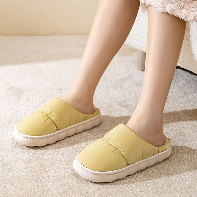 Pair of down cotton slippers with artificial leather upper and thick rubber sole, shown in available colours.