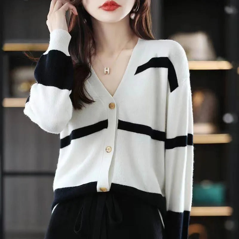 Women's slim fit V-neck cardigan with a raised 3D striped knit pattern in black and white.