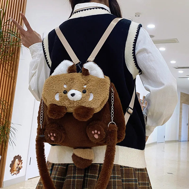 Coati plush cartoon backpack in brown with soft plush exterior and polyester lining, height 26cm, width 27cm