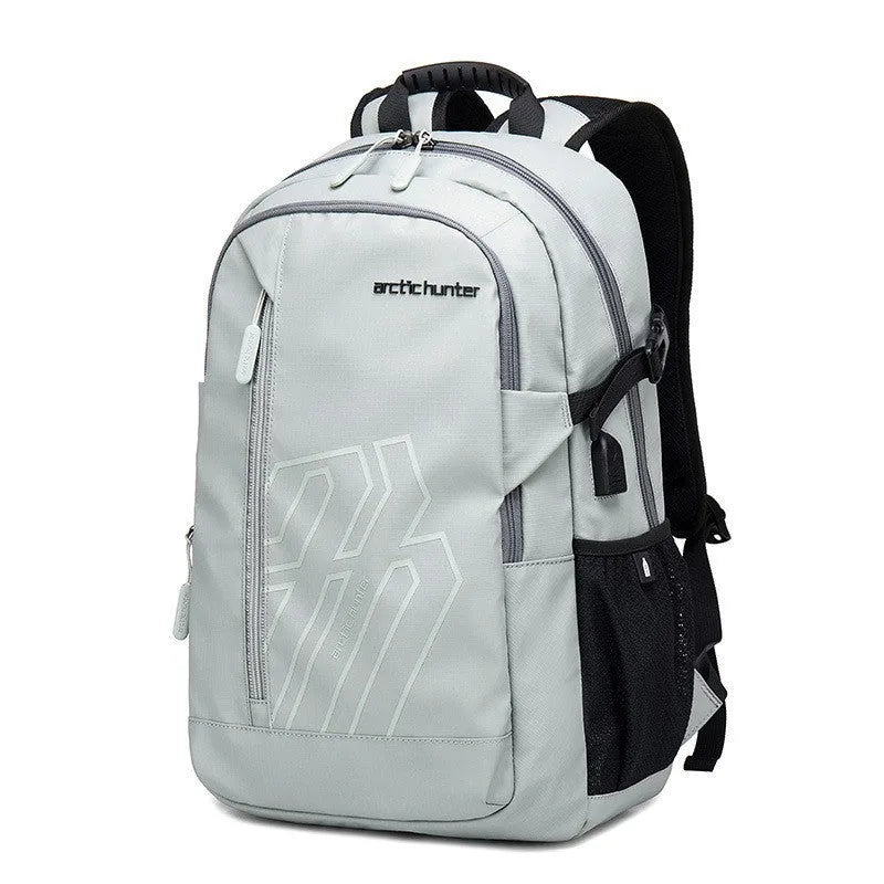 Blue plaid 18 inch laptop backpack with curved shoulder strap showing front pocket.