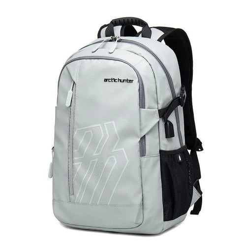 Blue plaid 18 inch laptop backpack with curved shoulder strap showing front pocket.