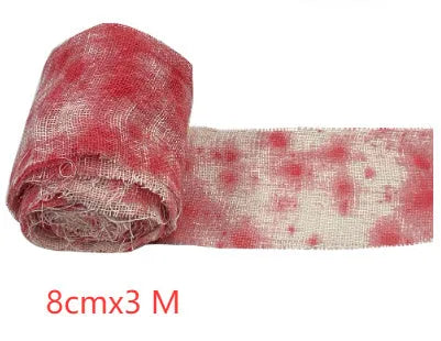 Halloween bloody dyed gauze bandage roll with 8cm width on wooden background