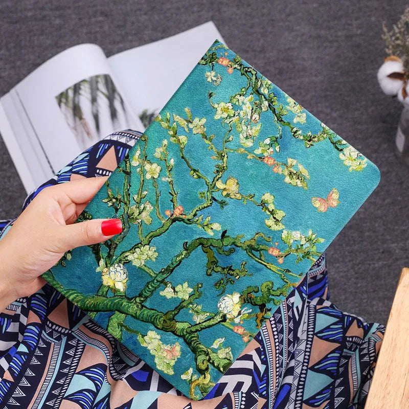 Handmade liquid silicone iPad flip case showing apricot flower artistic design on cover.