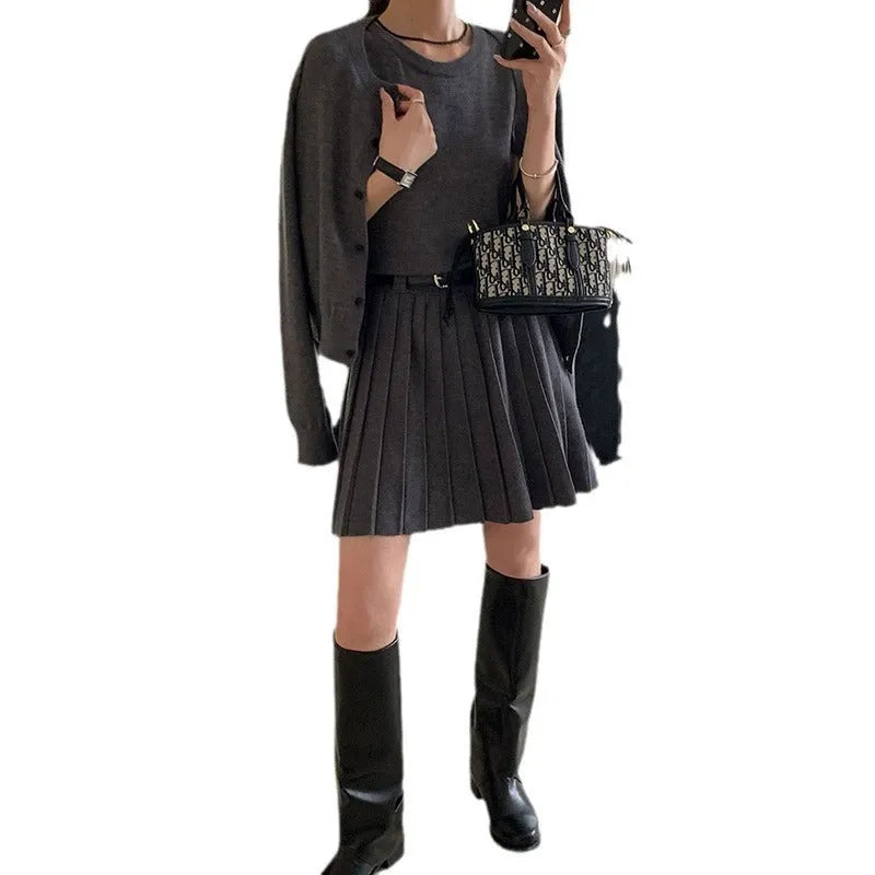 Grey art retro knitted two-piece set with 3D pattern, featuring a pleated vest skirt and long-sleeved cardigan with an adjustable belt.