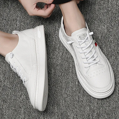 White casual lace-up leather shoes with inner height increase, round toe, rubber outsole, on a clean background