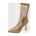 Gold coloured high heel sandals with a pointed toe and stiletto heel, featuring a mesh upper.