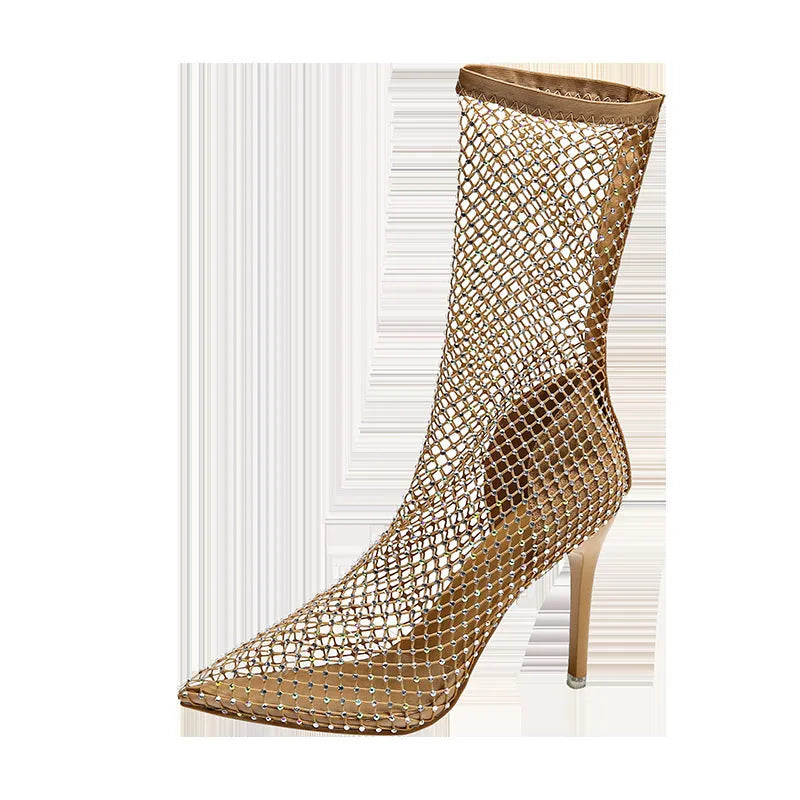 Gold coloured high heel sandals with a pointed toe and stiletto heel, featuring a mesh upper.