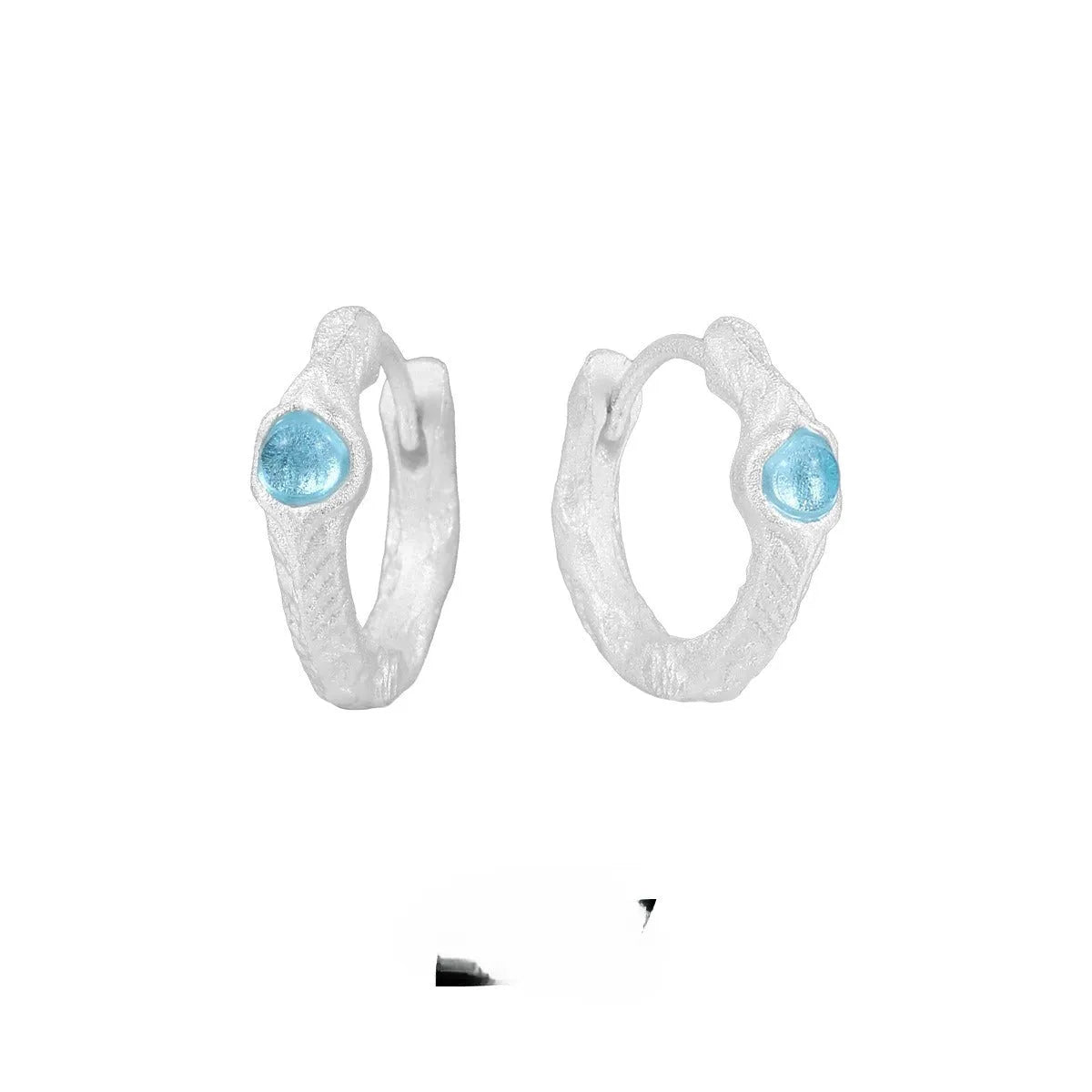 Geometric circle ear clip in burnt silver finish made from 925 sterling silver
