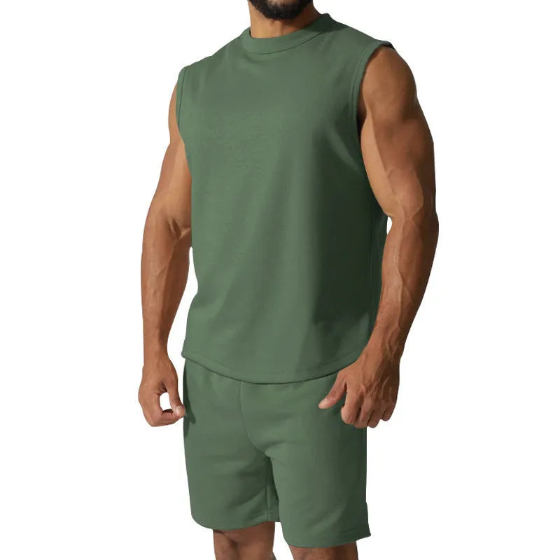 Men's sleeveless cotton blend sports top and matching shorts in a solid colour, laid flat.