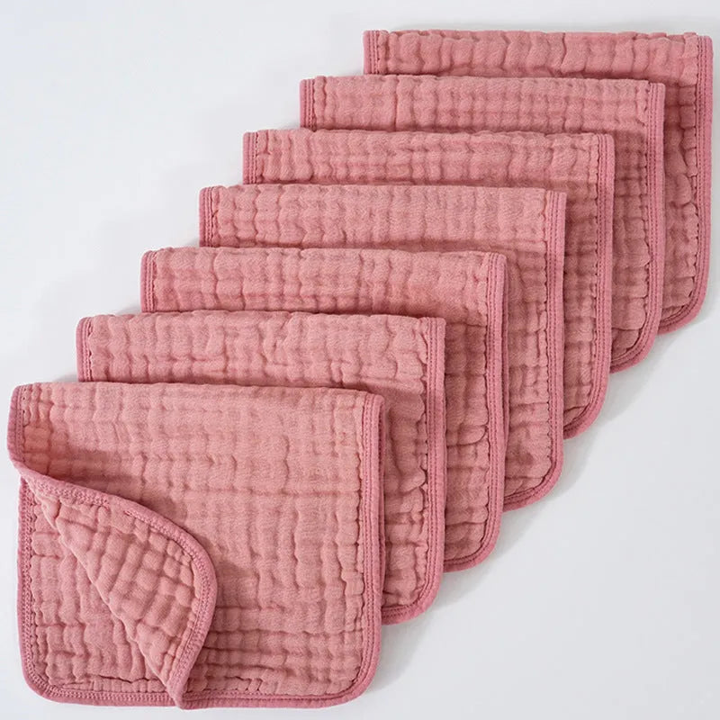 Set of six large muslin burp cloths 25x50cm in assorted colours on white background
