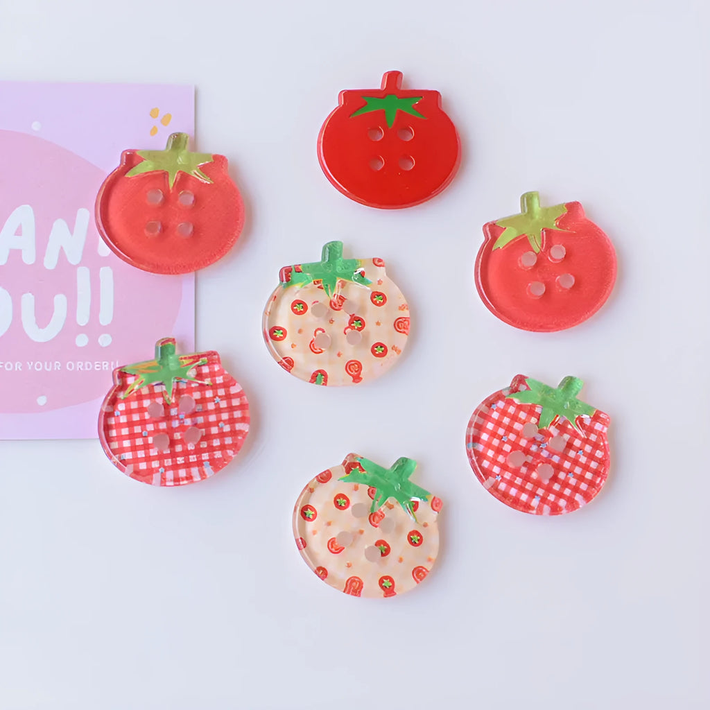 Medium plastic tomato button ornaments with printed patterns in various red colour options