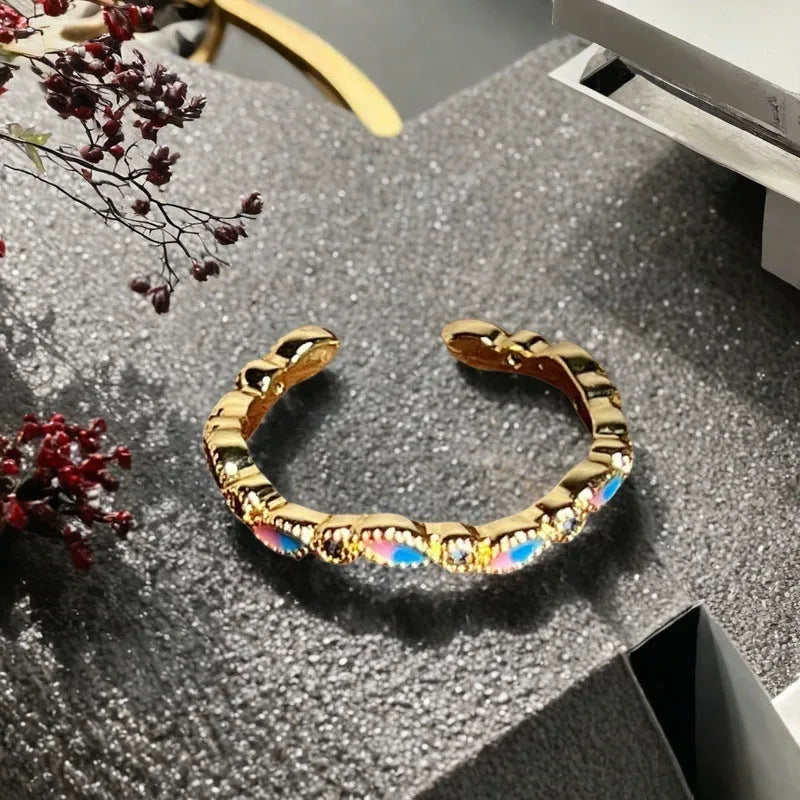 Adjustable copper ring with vintage gourd, floral, and bow design in New Chinese style, set with zircon stones.