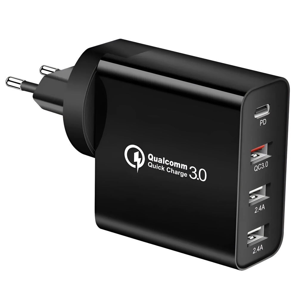 A white or black multi-port USB fast charger with PD and QC ports on a table.