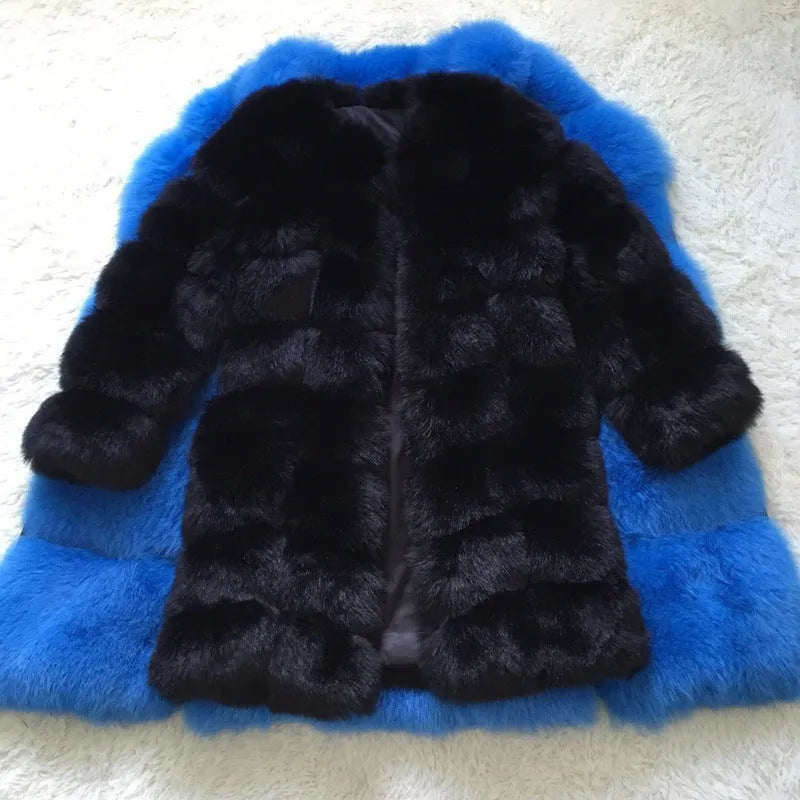 Women's thick black artificial fur coat with regular sleeves on a model.