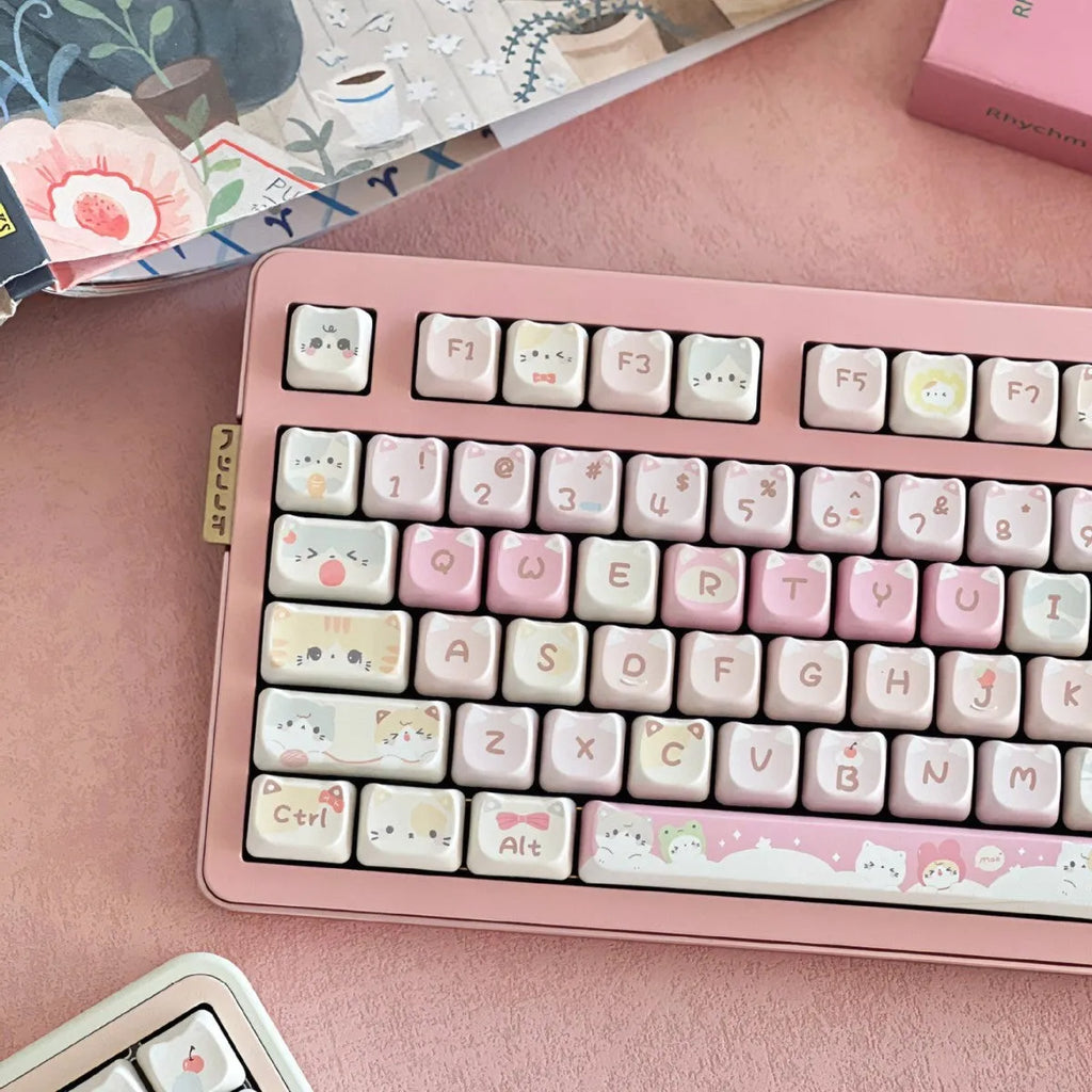 Meow Meow Team mechanical keyboard key cap set showing 141 keys with feline character artwork on all sides