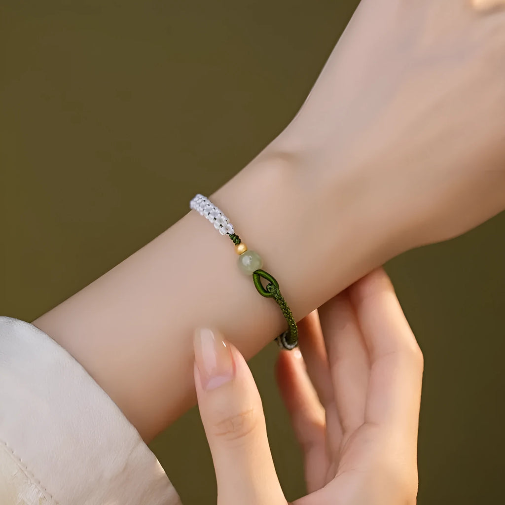 Hetian jade and sterling silver bracelet on a colourful electroplated cord strap.